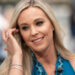 Kate Gosselin touching her hair