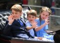 George, Louis, and Charlotte waving to crowds from a carriage