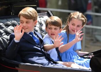 George, Louis, and Charlotte waving to crowds from a carriage