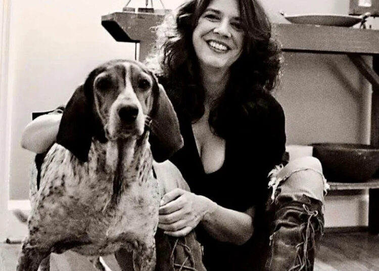 A 2015 picture of Nashville music industry publicist Kim Fowler in her East Nashville house with her dog Goose, one of the pets who inspired the name of her company, Two Dog Media