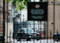 Prince Harry, inside a vehicle, arrives at Clarence House on Wednesday afternoon.