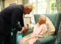 King Charles III meets the world's oldest person, 116-year-old Ethel Caterham, at Hallmark Lakeview Care Home in Lightwater