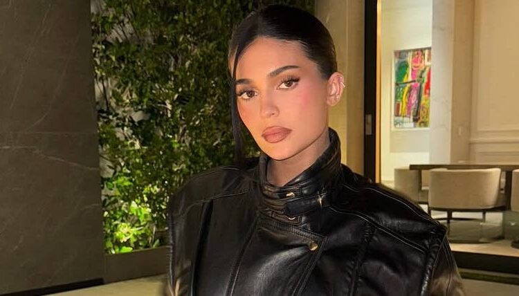 Kylie Jenner Rings in F1 Season in a Miniskirt Covered in Belts