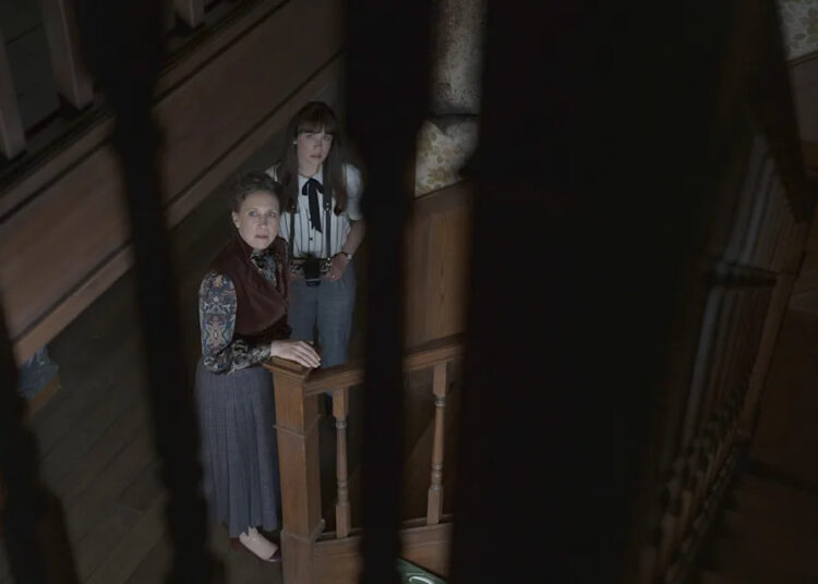 Lorraine (Vera Farmiga, left) sticks close to protect daughter Judy (Mia Tomlinson) from evil in "The Conjuring: Last Rites."