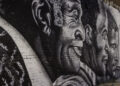 A new mural, depicting actor John Amos, Jr. (center), flanked by his father and son, located at 88 S. Front Street.