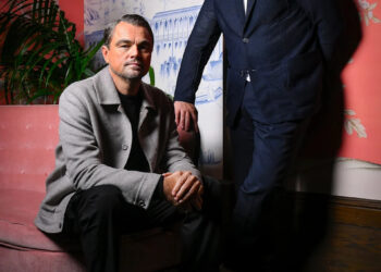 Leonardo DiCaprio (left) and Benicio del Toro pose for a portrait at The Aster hotel on Sept. 9, 2025, where the two Oscar-winning actors discussed their new movie "One Battle After Another."