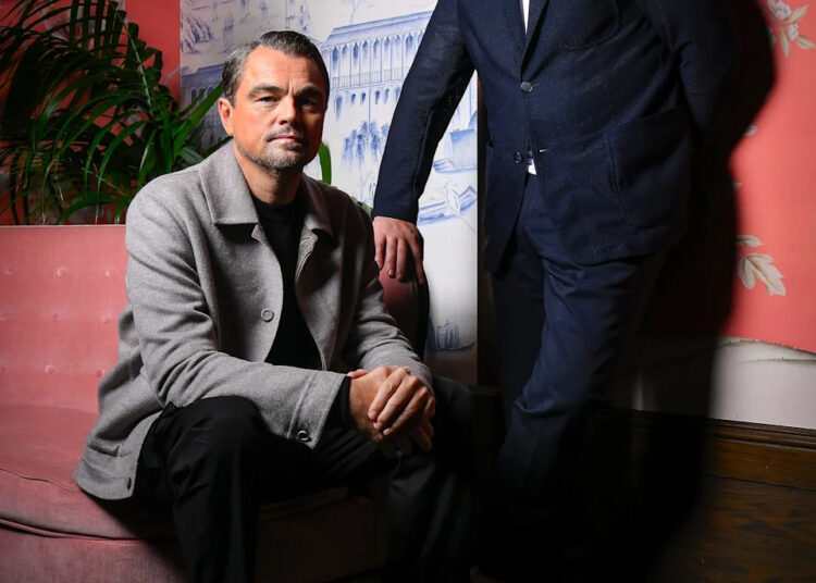 Leonardo DiCaprio (left) and Benicio del Toro pose for a portrait at The Aster hotel on Sept. 9, 2025, where the two Oscar-winning actors discussed their new movie "One Battle After Another."