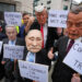 Protesters wear masks of politicians during a demonstration of the Stop Trump Coalition group in London. Some of the protesters are holding signs that read: