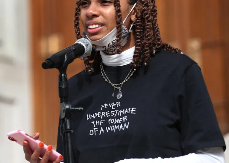 Taylor Hall, an "artivist," speaks during the "Crossroads of Democracy: Day of Action" event at the Indiana Statehouse, Saturday, Oct. 17, 2020.  The event aims to empower young activists fighting for equity, equality, social and economic justice, and generational change in politics. Artivism, Indiana Nasty Women, and Indiana Black Legislative Caucus are hosting the event.