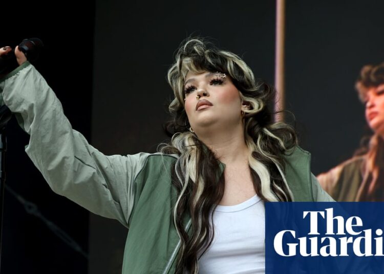 Lola Young ‘doing OK’ after collapsing on stage at festival in New York | Music