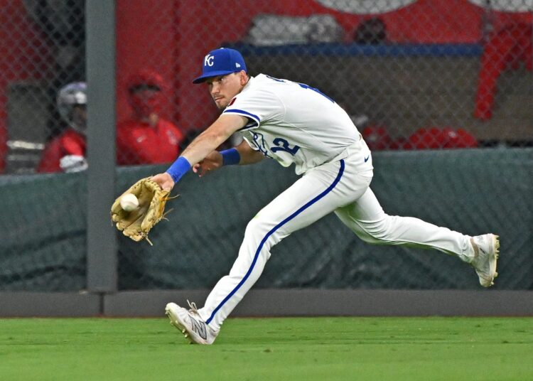 Sep 2, 2025; Kansas City, Missouri, USA;  Kansas City Royals left fielder Nick Loftin (12) makes a running catch in the ninth inning against the Los Angeles Angels at Kauffman Stadium. Mandatory Credit: Peter Aiken-Imagn Images