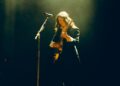 Lucy Dacus plays guitar onstage at Forest Hills Stadium.