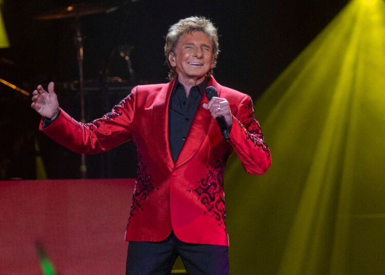 Barry Manilow will be making his final stops at the Kia Center in Orlando and the Benchmark International Arena in Tampa during January 2026. (Photo by Paul R. Giunta/Invision/AP)