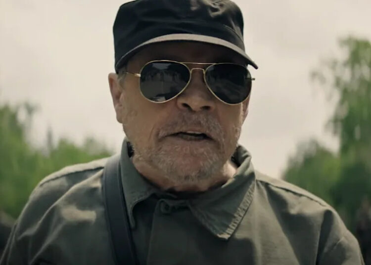 Mark Hamill in The Long Walk giving speech.