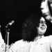 Mark volman performs onstage with a tambourine