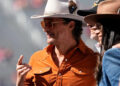 Matthew McConaughey stands on the field prior to the NCAA football game between the Ohio State Buckeyes and the Texas Longhorns at Ohio Stadium on Aug. 30, 2025.