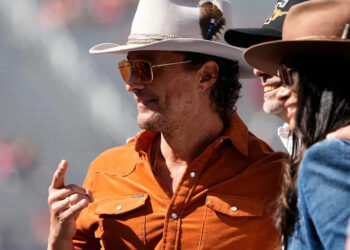 Matthew McConaughey stands on the field prior to the NCAA football game between the Ohio State Buckeyes and the Texas Longhorns at Ohio Stadium on Aug. 30, 2025.