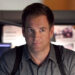 Michael Weatherly's Tony DiNozzo seated at his desk in NCIS.
