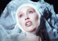 Still from Miley Cyrus music video "Secrets."
