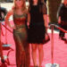 Jennette McCurdy and Miranda Cosgrove posing together on the red carpet.