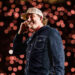 Country singer Morgan Wallen wears blue denim shirt and hat