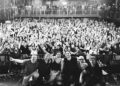 A black and white image of the band in front of a crowd at a show