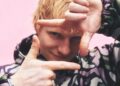 Ed Sheeran making play button with hands