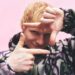 Ed Sheeran making play button with hands