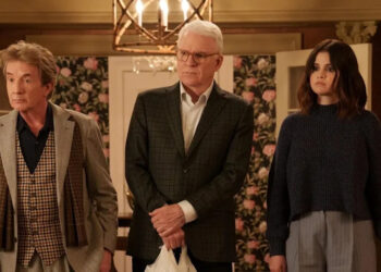 Charles, Oliver and Mabel with shopping bags in Only Murders in the Building.