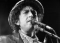 This file photo taken on June 03, 1984 shows US singer Bob Dylan performing during a concert at the Olympic stadium in Munich, southern Germany.