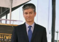 Television writer Michael Schur stands atop his star during an unveiling ceremony honoring Schur with the 2,812th star on the Hollywood Walk of Fame in Los Angeles in May. File Photo by Jim Ruymen/UPI