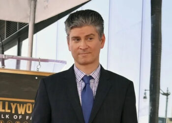 Television writer Michael Schur stands atop his star during an unveiling ceremony honoring Schur with the 2,812th star on the Hollywood Walk of Fame in Los Angeles in May. File Photo by Jim Ruymen/UPI