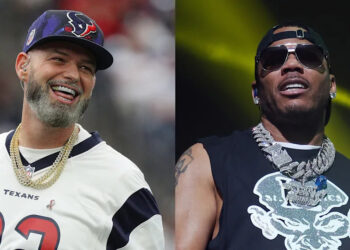 Paul Wall in a Texans jersey, wearing a cap and chains; Nelly performing in sunglasses and chains.