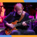 Phish frontman Trey Anastasio noodles on guitar.