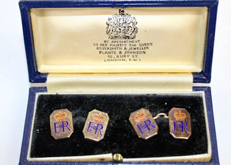 A pair of 9ct gold and enamel octagonal cufflinks with crowned ERII ciphers presented by Queen Elizabeth II to Squadron Leader Denis Lowery.