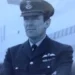 Hansons Auctioneers A black and white photograph of Squadron Leader Denis Lowery. He is wearing his RAF uniform, a hat and with his arms folded.