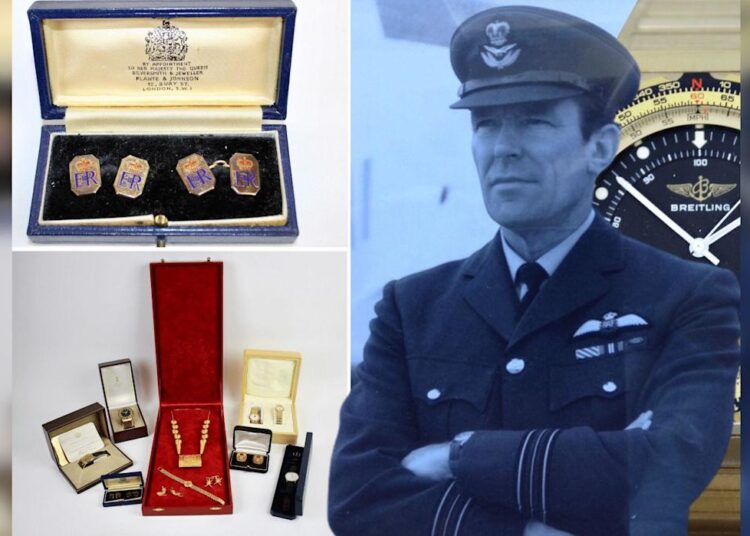 A photo of Squadron Leader Denis Lowery, in his RAF uniform, along with gifts presented to him. This includes cufflinks from Queen Elizabeth II and other jewellery gifted to him from the Sultan of Oman.