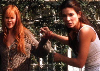Nicole Kidman and Sandra Bullock as Gilly and Sally looking in backyard in disbelief in Practical Magic .