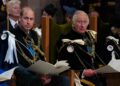 FILE - Britain's Prince William, known as the Duke of Rothesay while in Scotland, and King Charles III during the National Service of Thanksgiving and Dedication for King Charles III and Queen Camilla, and the presentation of the Honours of Scotland, at St Giles' Cathedral, in Edinburgh, Wednesday, July 5, 2023. Buckingham Palace says King Charles III will undergo a "corrective procedure" next week for an enlarged prostate. (Jane Barlow/Pool photo via AP, File)