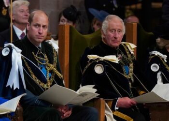 FILE - Britain's Prince William, known as the Duke of Rothesay while in Scotland, and King Charles III during the National Service of Thanksgiving and Dedication for King Charles III and Queen Camilla, and the presentation of the Honours of Scotland, at St Giles' Cathedral, in Edinburgh, Wednesday, July 5, 2023. Buckingham Palace says King Charles III will undergo a "corrective procedure" next week for an enlarged prostate. (Jane Barlow/Pool photo via AP, File)
