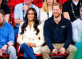Prince Harry and Meghan Markle sitting together