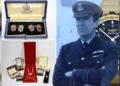 Hansons Auctioneers A photo of Squadron Leader Denis Lowery, in his RAF uniform, along with gifts presented to him. This includes cufflinks from Queen Elizabeth II and other jewellery gifted to him from the Sultan of Oman.