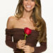 Taylor Frankie Paul posing in a brown off-the-shoulder dress while holding a red rose for The Bachelorette promo photo