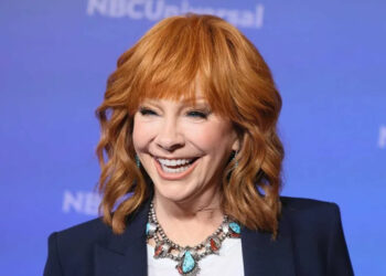 Reba McEntire smiling and posing at the 2024 TCA Summer Press Tour.