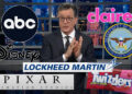 Stephen Colbert on set with logos of ABC, Claire's, Disney, Department of Defense, Lockheed Martin, Pixar, and Twizzlers.