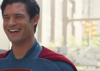 David Corenswet laughs  on the set of Superman.