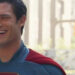 David Corenswet laughs  on the set of Superman.