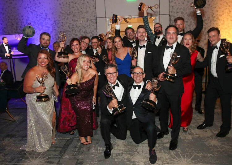 Stephen Colbert with his talk show crew after winning the award for outstanding talk series award for "The Late Show with Stephen Colbert"