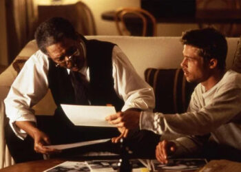 Peter Sorel Morgan Freeman and Brad Pitt checking out the charts and graphs to figure out the mystery of 'Seven'