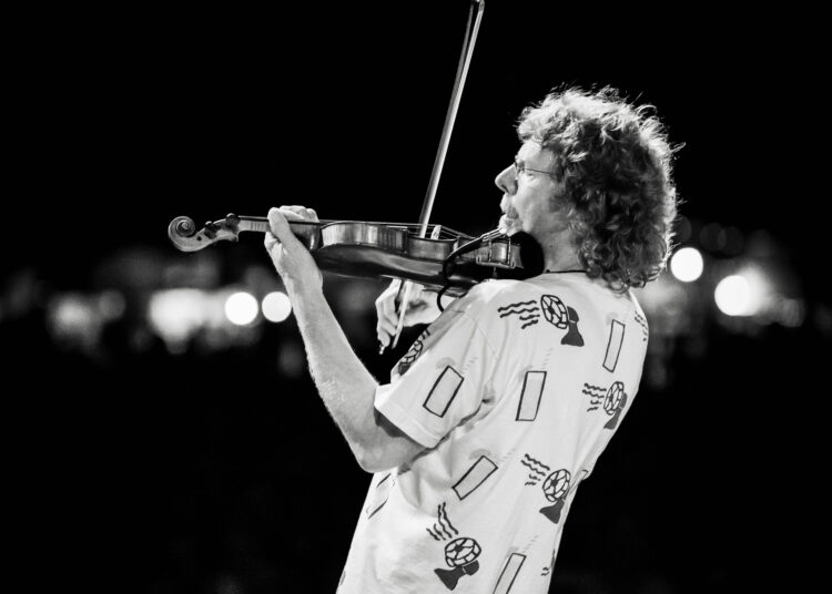 Sam Bush playing fiddle